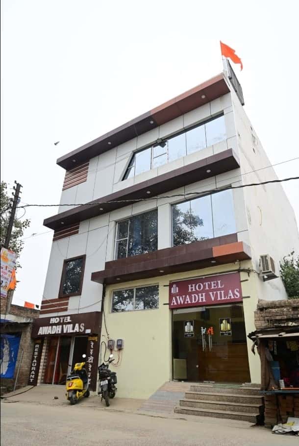 Hotel exterior with garden and entrance